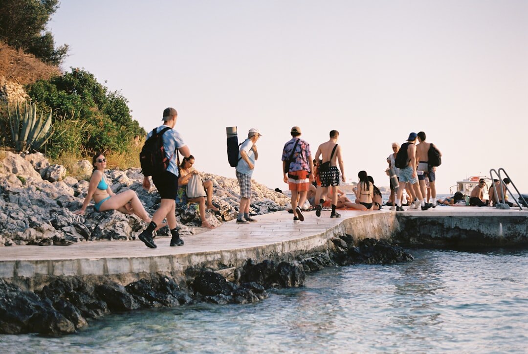 Group of seniors boarding a tour bus for an excursion along the Croatian coast