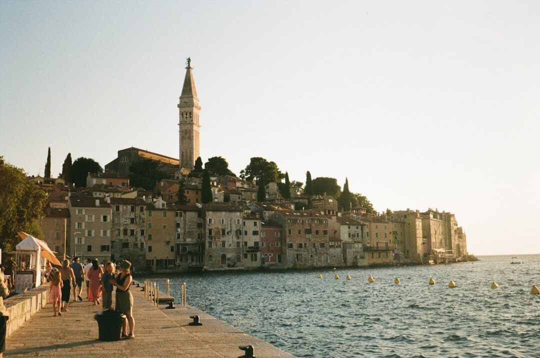 Senior couple walking together along the Adriatic coast promenade
