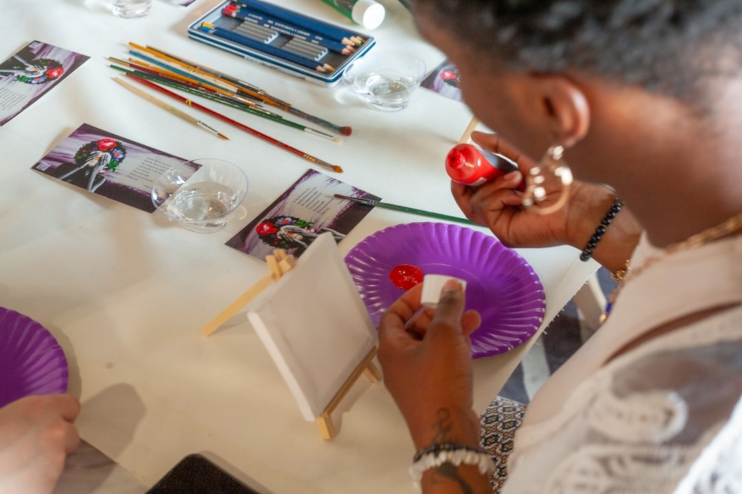 Seniors painting and doing crafts together in an art workshop