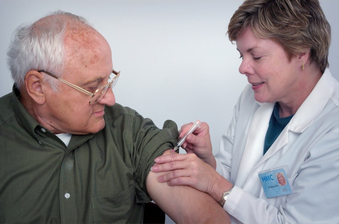 Senior having a friendly health checkup with a nurse