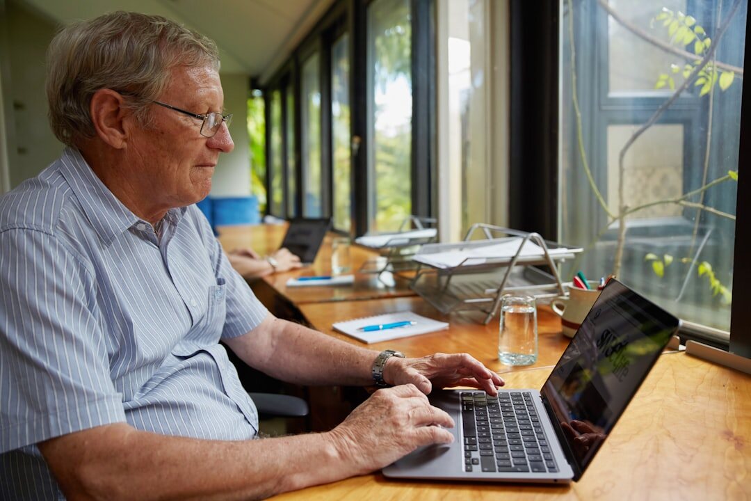senior using laptop safely