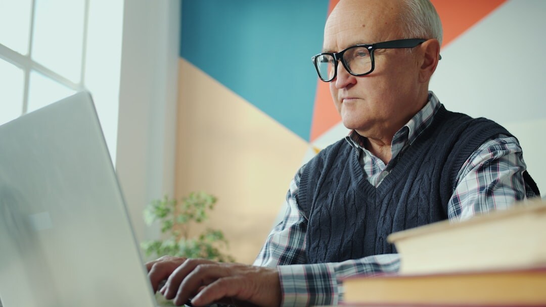 elderly man checking email